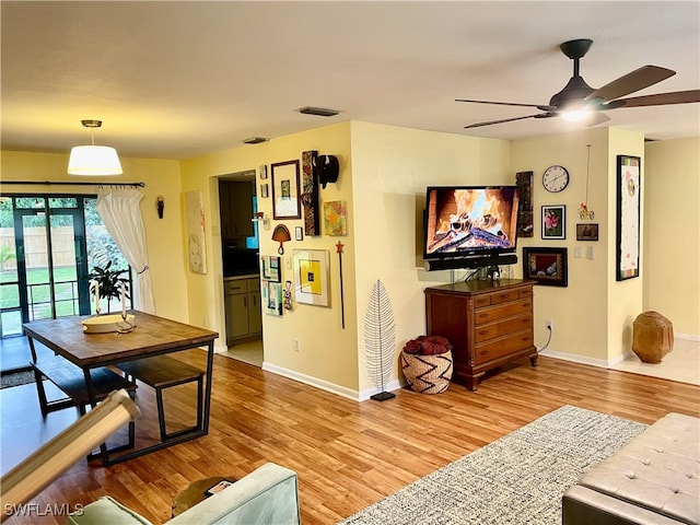 dining room featuring ceiling fan and hardwood / wood-style flooring