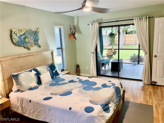 bedroom featuring access to exterior, ceiling fan, and hardwood / wood-style floors