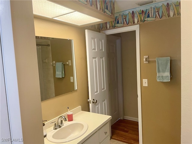 bathroom featuring vanity and hardwood / wood-style flooring