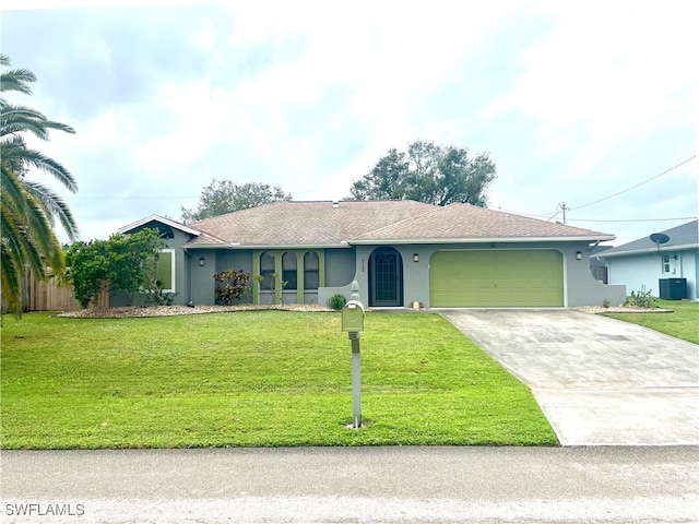 ranch-style house featuring cooling unit, a front yard, and a garage