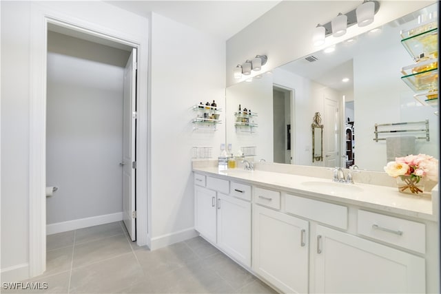 bathroom with vanity and tile patterned floors