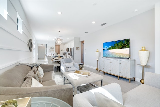 living room featuring a chandelier