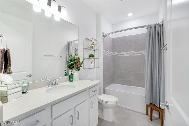 full bathroom with tile patterned floors, vanity, toilet, and shower / bath combo with shower curtain