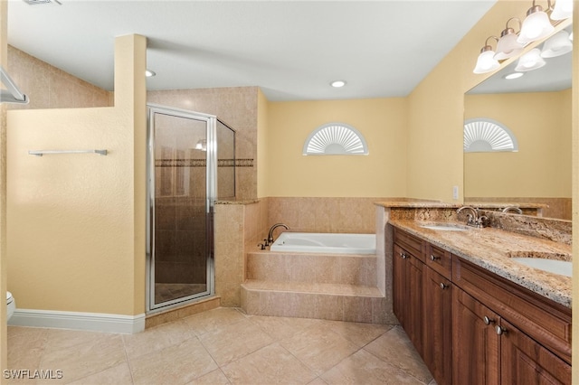 full bathroom featuring separate shower and tub, a wealth of natural light, tile patterned floors, and vanity