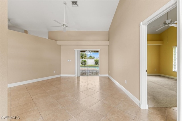 carpeted spare room with high vaulted ceiling and ceiling fan