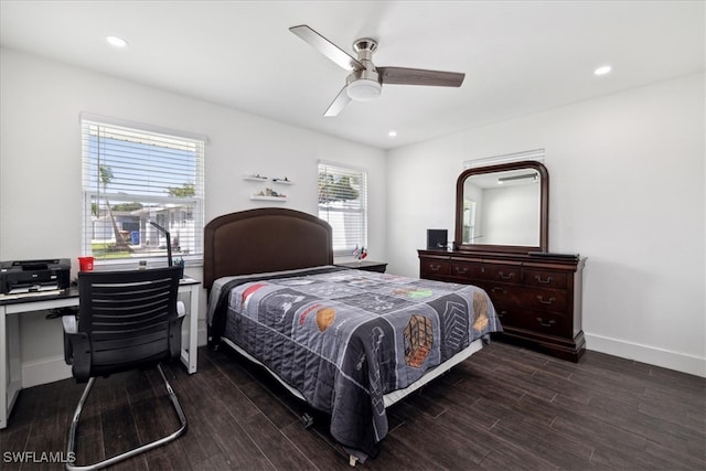 bedroom with ceiling fan and dark hardwood / wood-style flooring