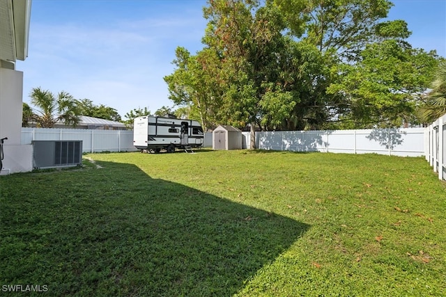 view of yard with a shed and cooling unit