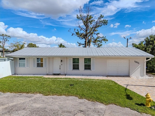 single story home with a garage and a front yard