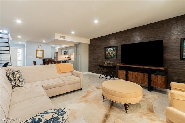 living room featuring wooden walls