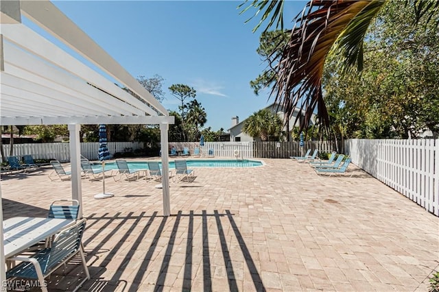 view of swimming pool with a pergola and a patio