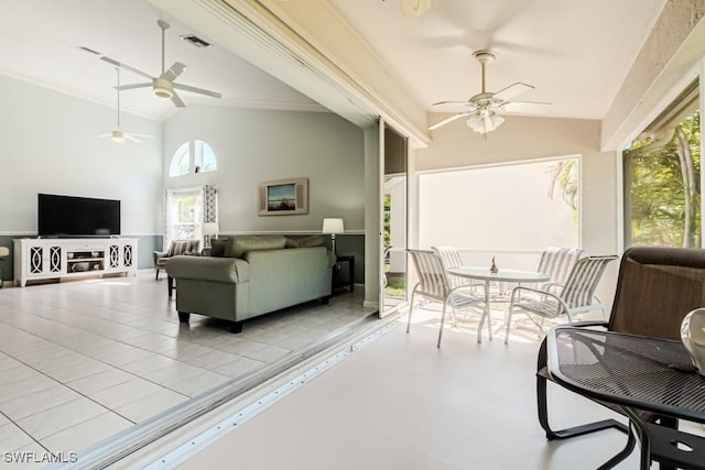 interior space featuring high vaulted ceiling, light tile patterned floors, visible vents, and a ceiling fan