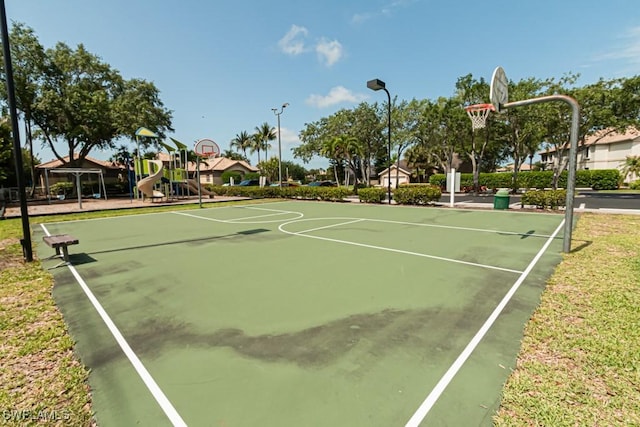 view of sport court featuring community basketball court, playground community, and a gazebo