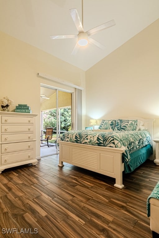 bedroom featuring dark wood-style floors, vaulted ceiling, and a ceiling fan