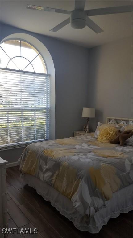 bedroom with ceiling fan and wood finished floors