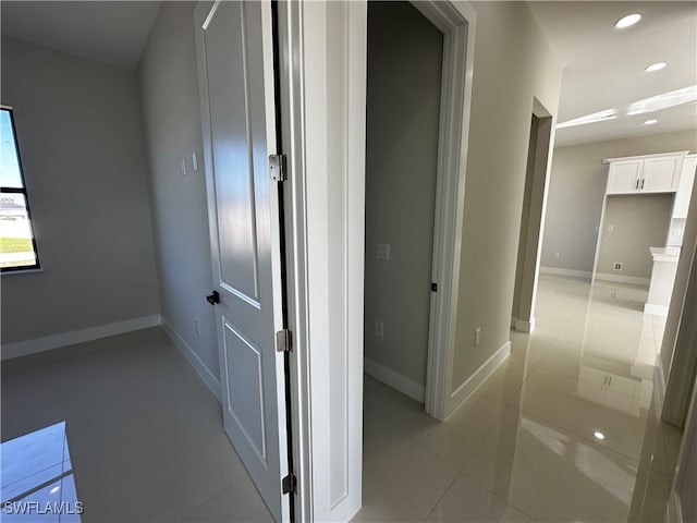 corridor featuring light tile patterned flooring