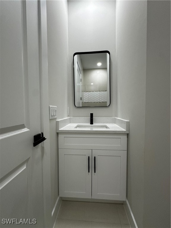 bathroom with tile patterned flooring and vanity