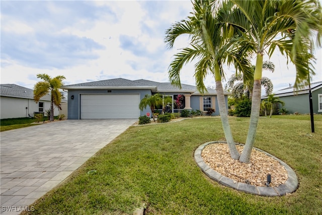 ranch-style home with a garage and a front lawn