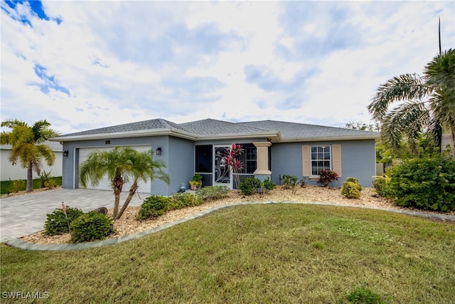 single story home with a garage and a front lawn