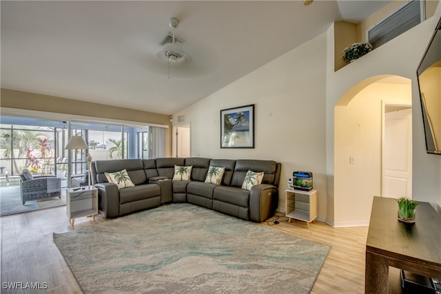 living room featuring light wood-type flooring, high vaulted ceiling, and ceiling fan