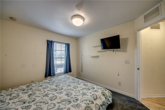 bedroom featuring light hardwood / wood-style floors