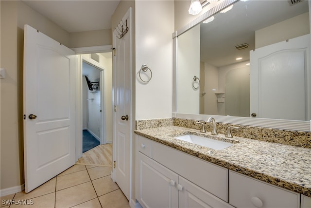 bathroom featuring tile patterned floors and vanity