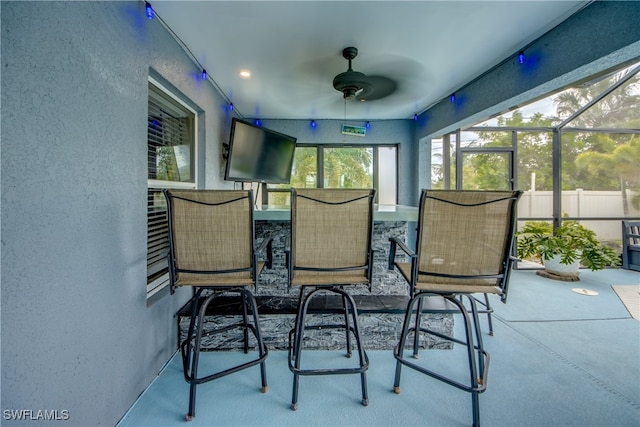 sunroom / solarium with ceiling fan