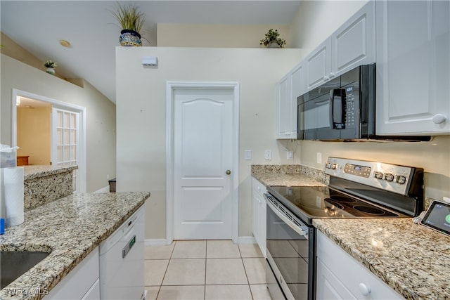 kitchen featuring light stone countertops, white dishwasher, light tile patterned floors, electric range, and white cabinetry