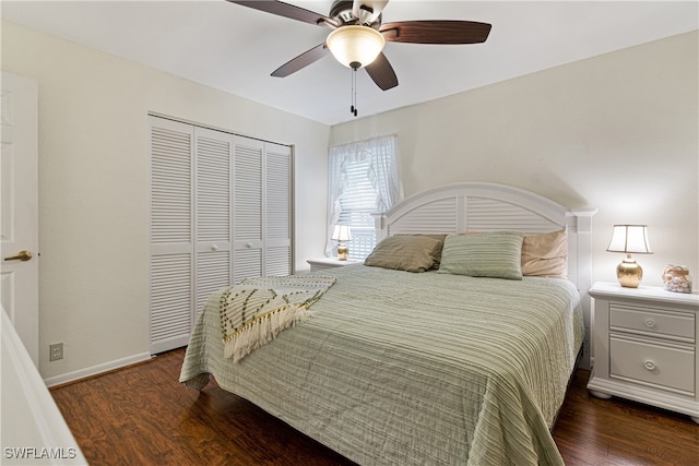 bedroom featuring ceiling fan, a closet, and dark wood-type flooring