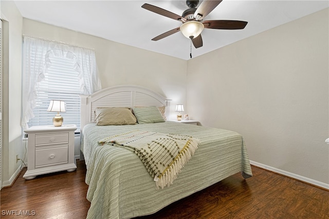 bedroom featuring dark hardwood / wood-style floors and ceiling fan