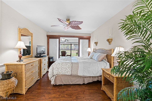 bedroom featuring ceiling fan, dark hardwood / wood-style floors, and access to exterior