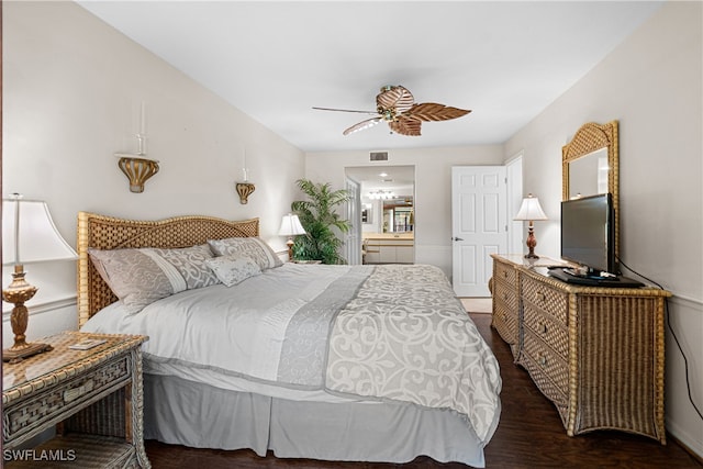 bedroom featuring ceiling fan, dark hardwood / wood-style floors, and ensuite bathroom