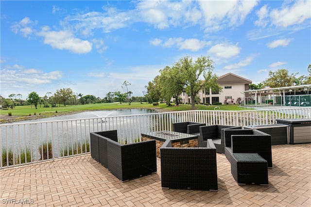 view of patio featuring an outdoor living space and a water view