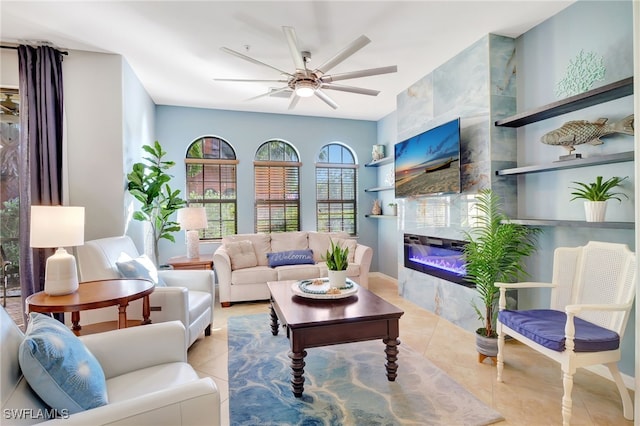 living room featuring ceiling fan and light tile patterned floors