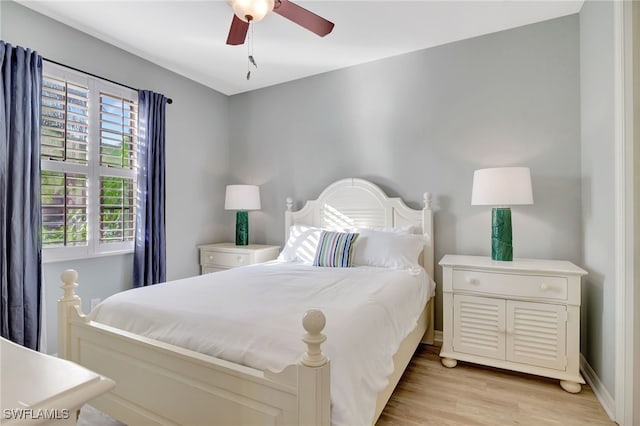 bedroom featuring ceiling fan and light hardwood / wood-style flooring