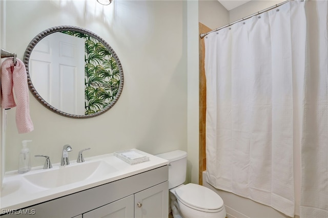 full bathroom with vanity, toilet, and shower / tub combo with curtain