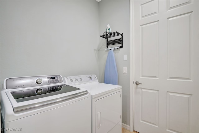 laundry room featuring independent washer and dryer