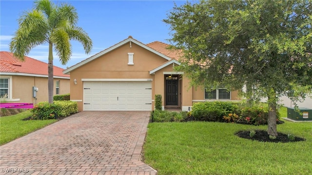 view of front of property featuring a front lawn and a garage