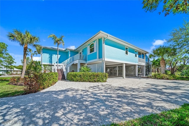 view of side of property featuring a carport