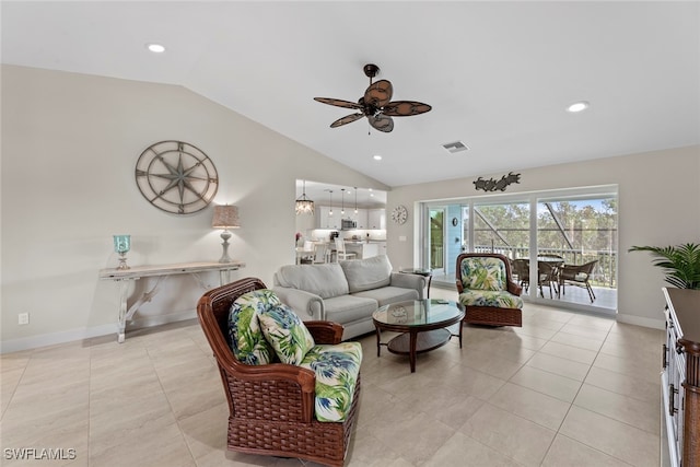 living room featuring vaulted ceiling, ceiling fan, and light tile patterned flooring