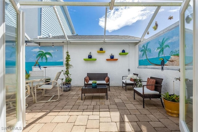 view of patio / terrace featuring a lanai