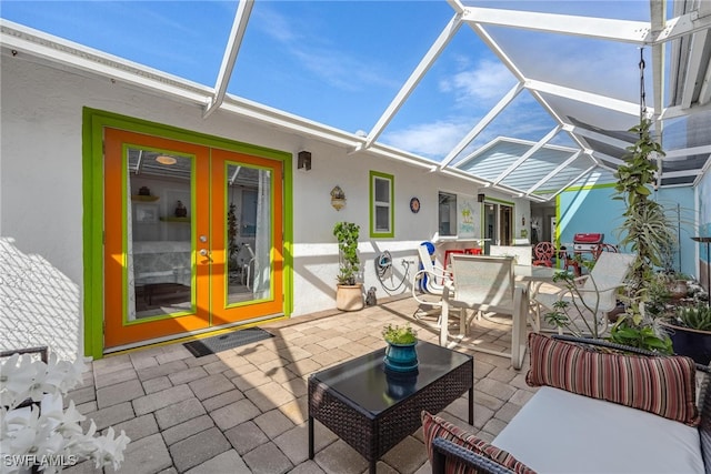 view of patio / terrace featuring a lanai and french doors