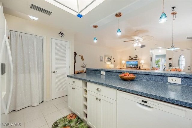 kitchen with white dishwasher, pendant lighting, ceiling fan, and light tile patterned flooring