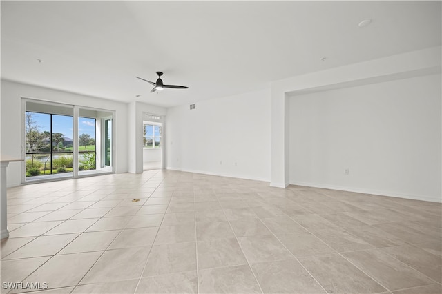 unfurnished room featuring ceiling fan and light tile patterned flooring