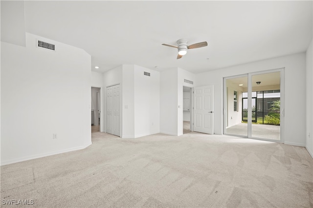 carpeted empty room with ceiling fan