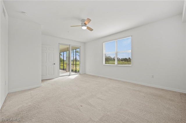 carpeted empty room with ceiling fan