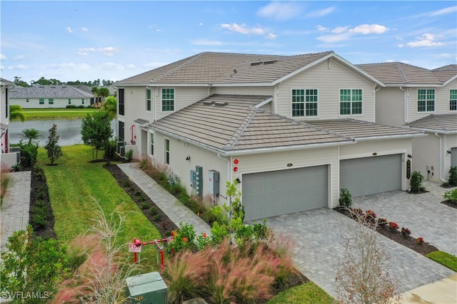 view of front of property with a garage and a front yard