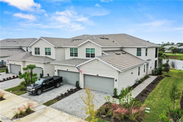 view of front facade with a front yard and a garage