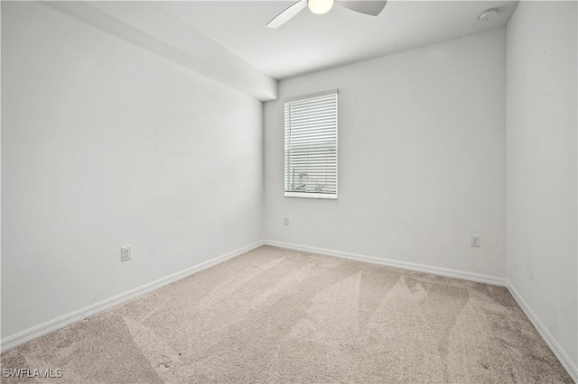 spare room with carpet and ceiling fan