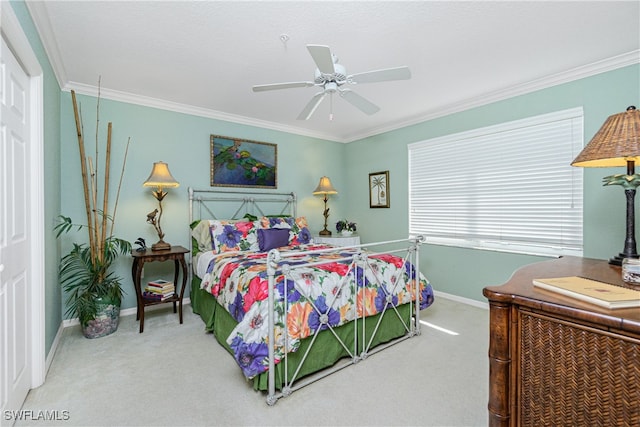 bedroom featuring ceiling fan, carpet, and ornamental molding