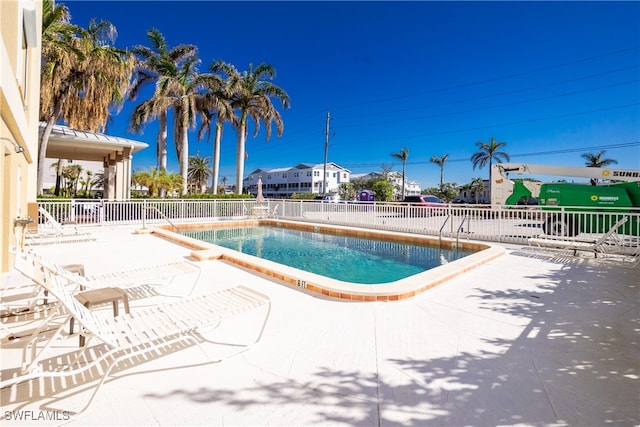 view of swimming pool with a patio area